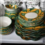 P59. Handpainted Mexican pottery dinnerware set. 